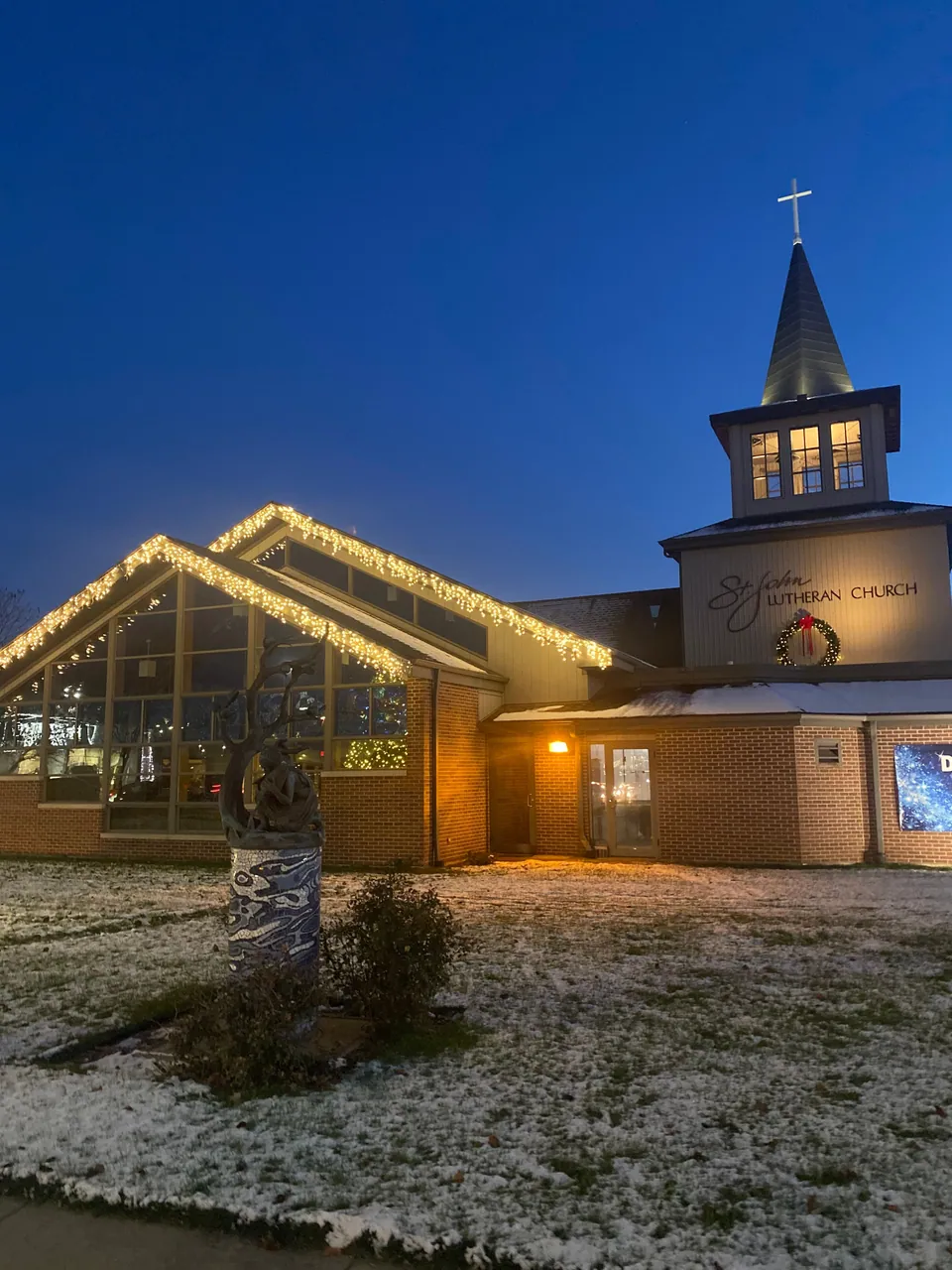 Another view of the church Christmas lights and wreath